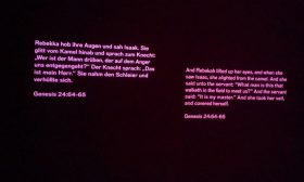 Quote from the Torah, projected onto the wall, Genesis 24, 64-65