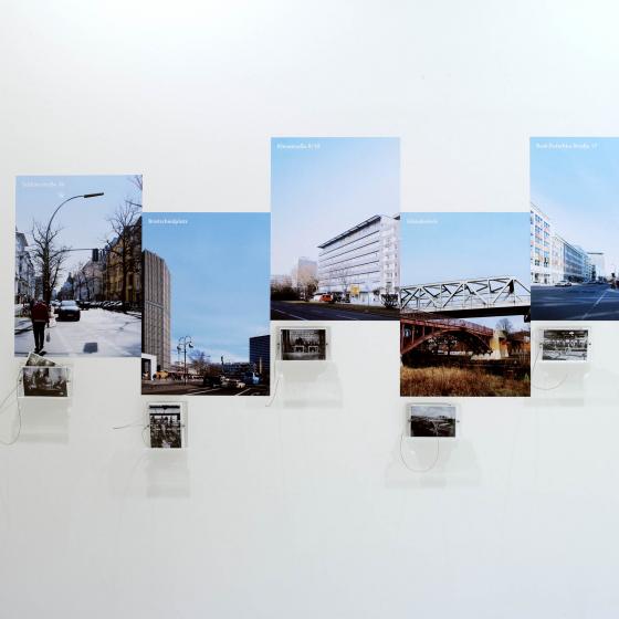 View of a wall with current color photographs and historical black and white photos