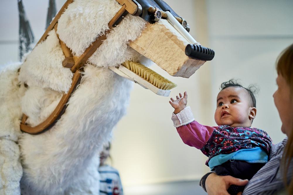 Toddler with an exhibition animal in the Children's World Anoha 