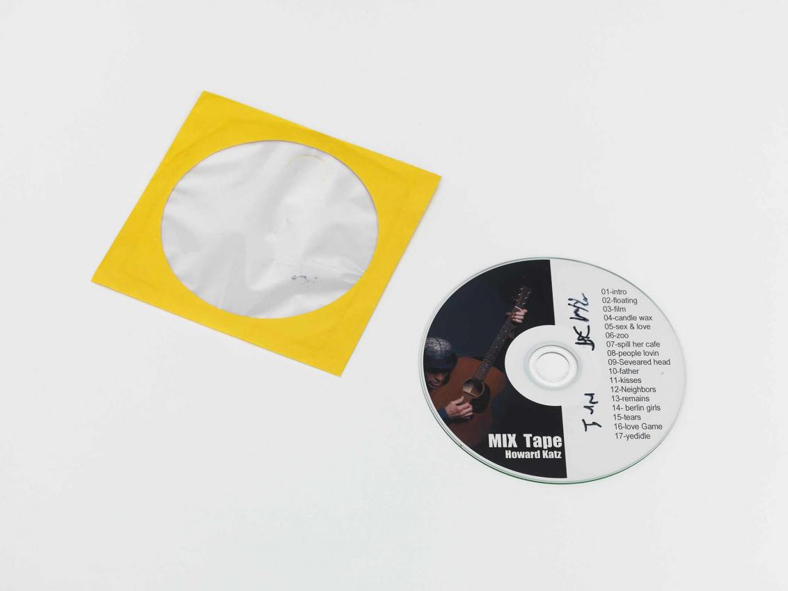 CD mix tape with bright yellow CD paper case