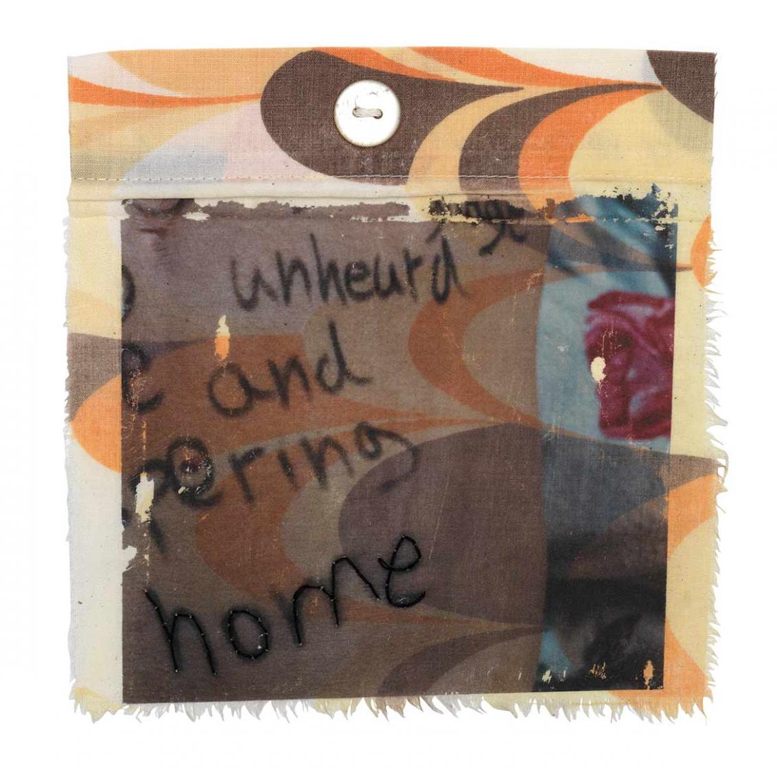 Nearly square piece of fabric from a used duvet cover with fraying edges and a multicolored “swoop” pattern with English words written on it, including the word “home” traced over in thread