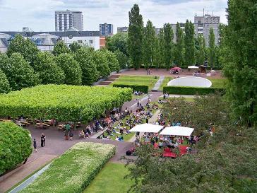View from above of the museum garden, where a well-attended concert takes place