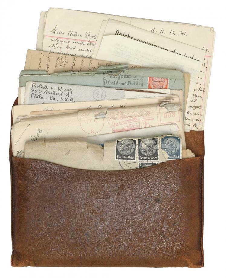 Photo of a leather pouch filled with letters
