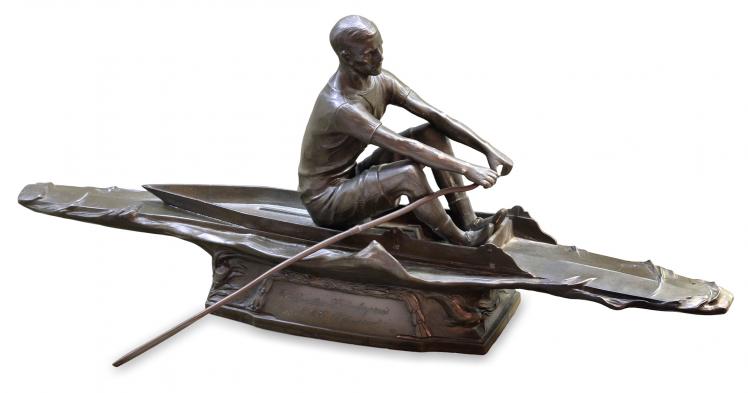 Bronze sculpture of a man rowing
