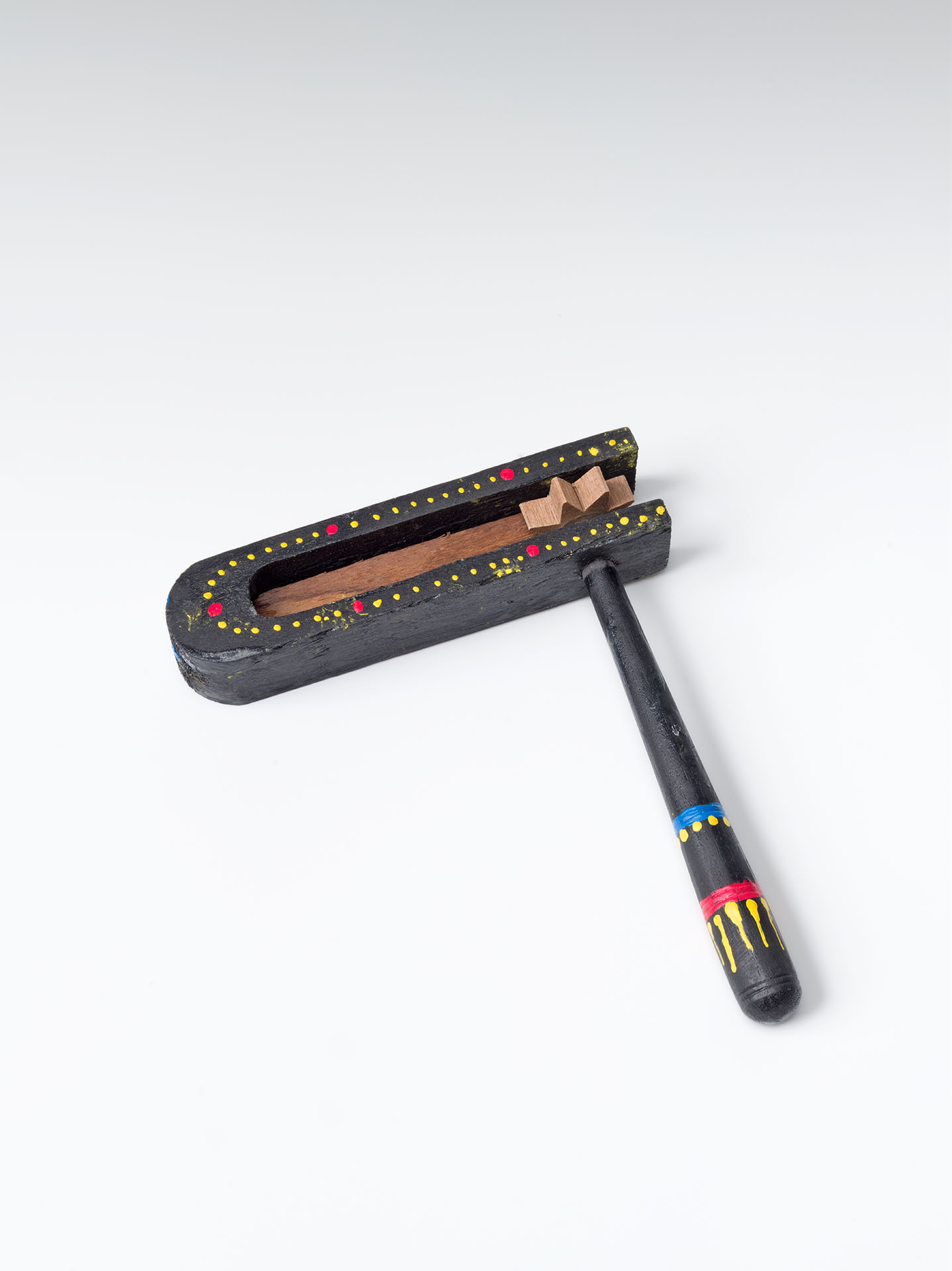 A black noisemaker with colorful decoration