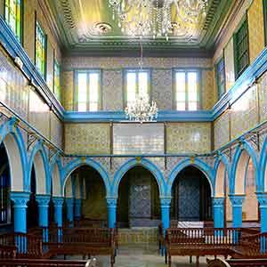 Interior of a richly decorated synagogue.