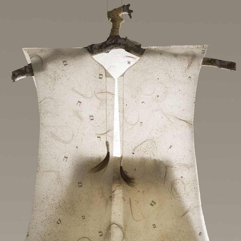 Paper dress with integrated human hair.