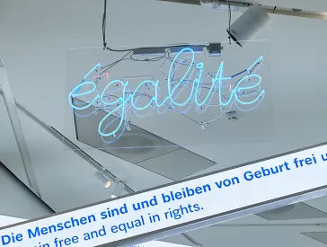 Exhibition view showing the neon lettering "égalité".