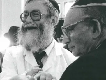 Two older men and a baby in their midst.