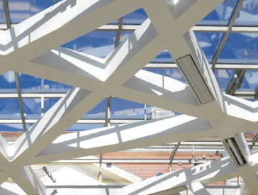 Ceiling of the Glass Courtyard against the blue sky.