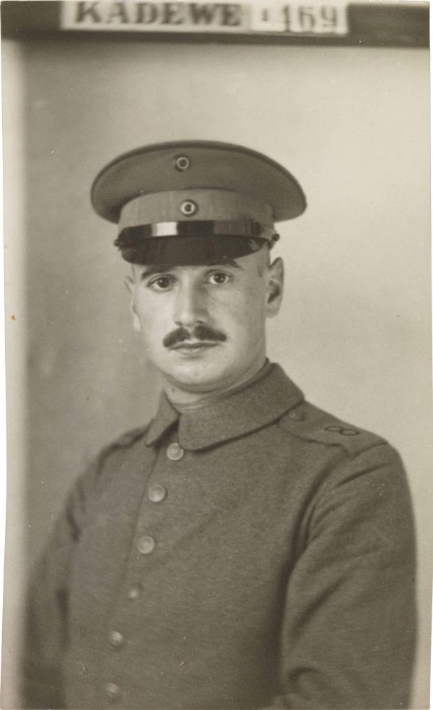 Black-and-white photograph: Portrait of a uniformed soldier