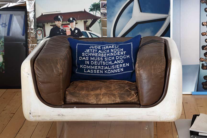 Blue pillow with uniform white script