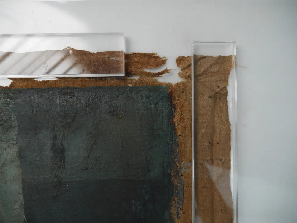 Close up of the canvas' marks and damages