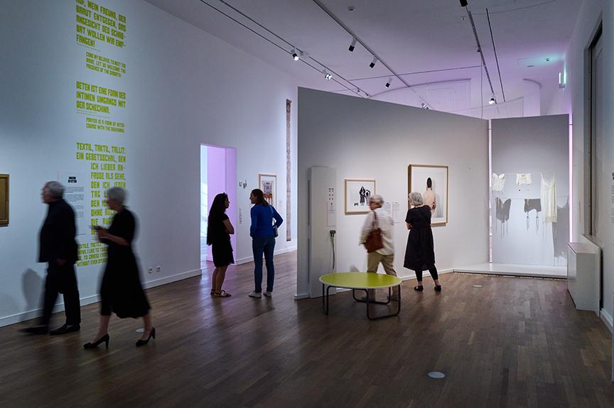 Opening of the exhibition "Sex. Jewish Positions", view into the exhibition room "Eroticism and the Divine" in the section "Devotion" with people