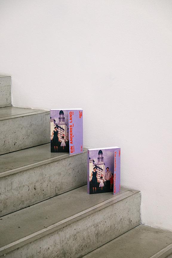 Exhibition catalogs upright on Libeskind staircase.