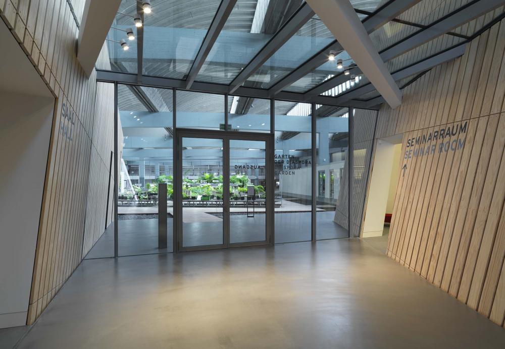 Entrance of the Academy Garden, the green plants can be seen through the glass doors and windows