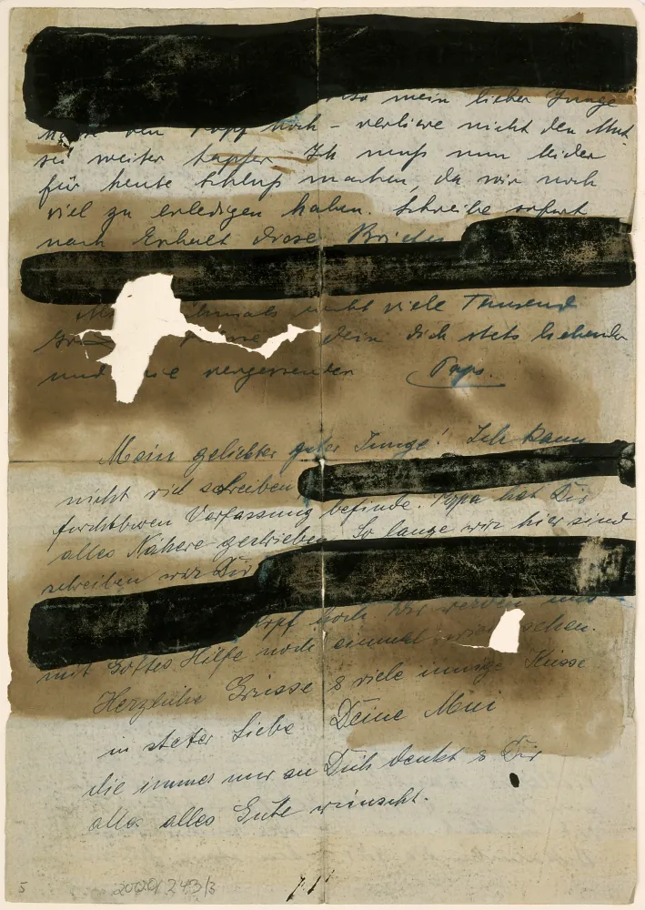 Handwritten letter with blackened sections