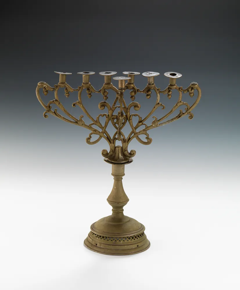 Photography: a brass candlestick with round base and seven candlesticks