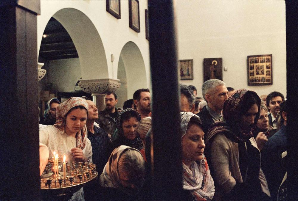 Women wearing kerchiefs in the nave of a church