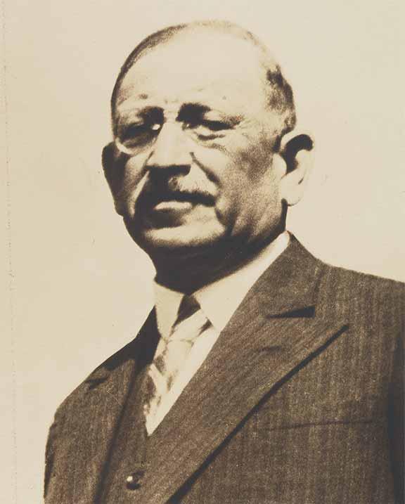 Portrait of an older gentleman in a suit and tie (black-and-white photo)