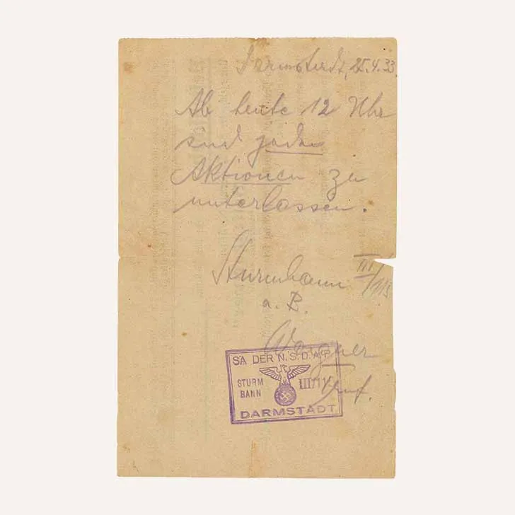Handwritten note, stamped and signed by SA Troop Leader Wagner. The text reads “Darmstadt, 25 April 1933. From noon today, all actions are to stop.”