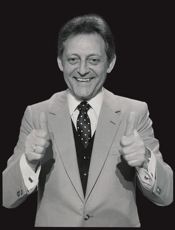 The black and white photo shows a half-portrait of a man with both thumbs up and looking friendly into the camera. 