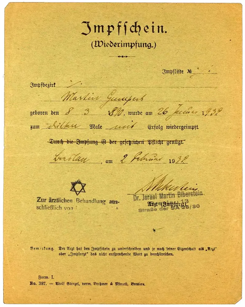 Vaccine certificate for Martin Gumpert with an imposed middle name added in, Breslau, 1 Feb 1939. The vaccine certificate bears a stamp indicating that the physician, Dr. Martin Biberstein, is authorized to treat Jewish patients exclusively.