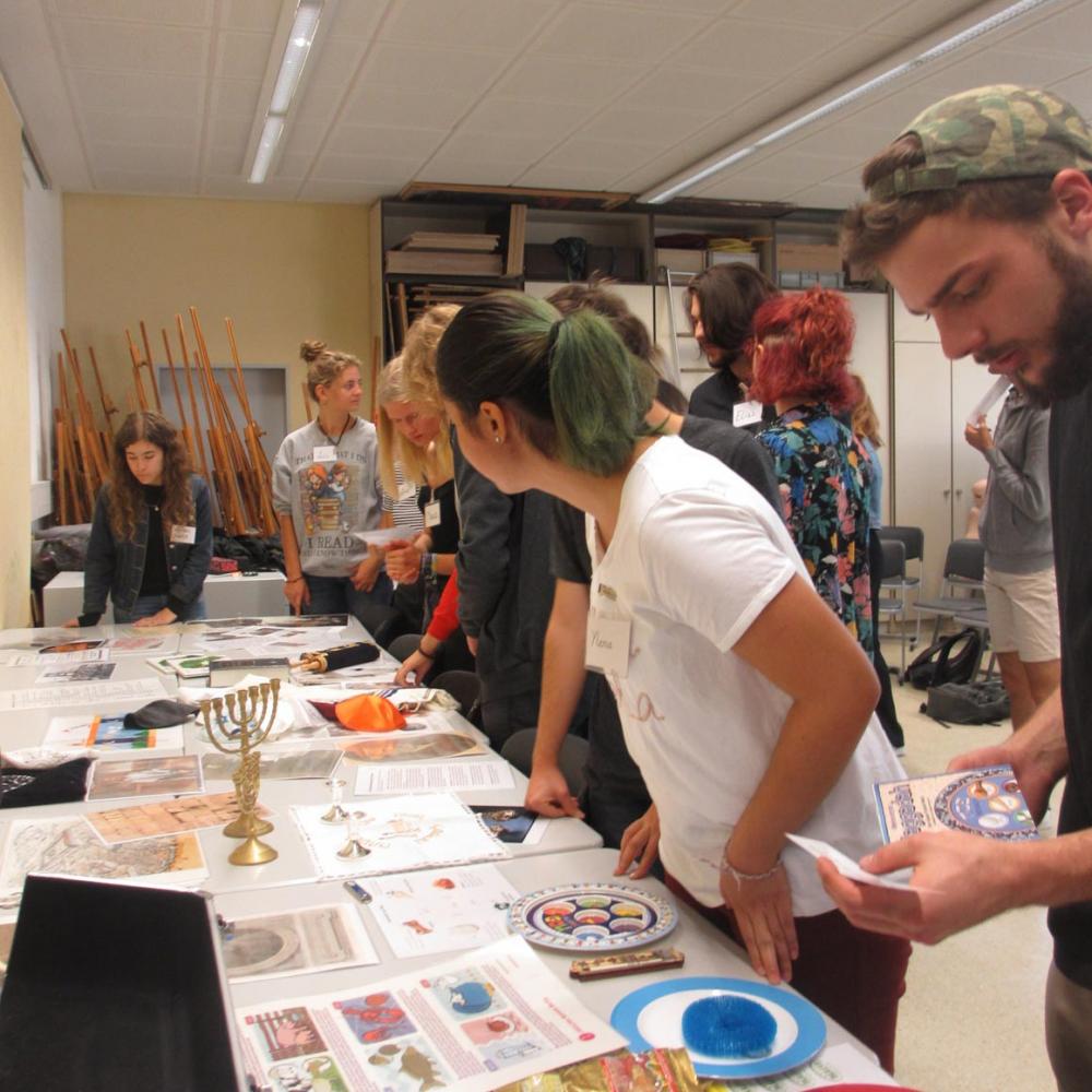 Teenagers at a table with hands-on objects