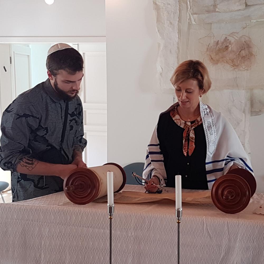 A rabbi reading from the Torah