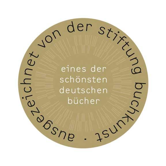 Runde Goldplakette mit der Aufschrift: ausgezeichnet von der Stiftung Buchkunst, eines der schönsten deutschen Bücher.