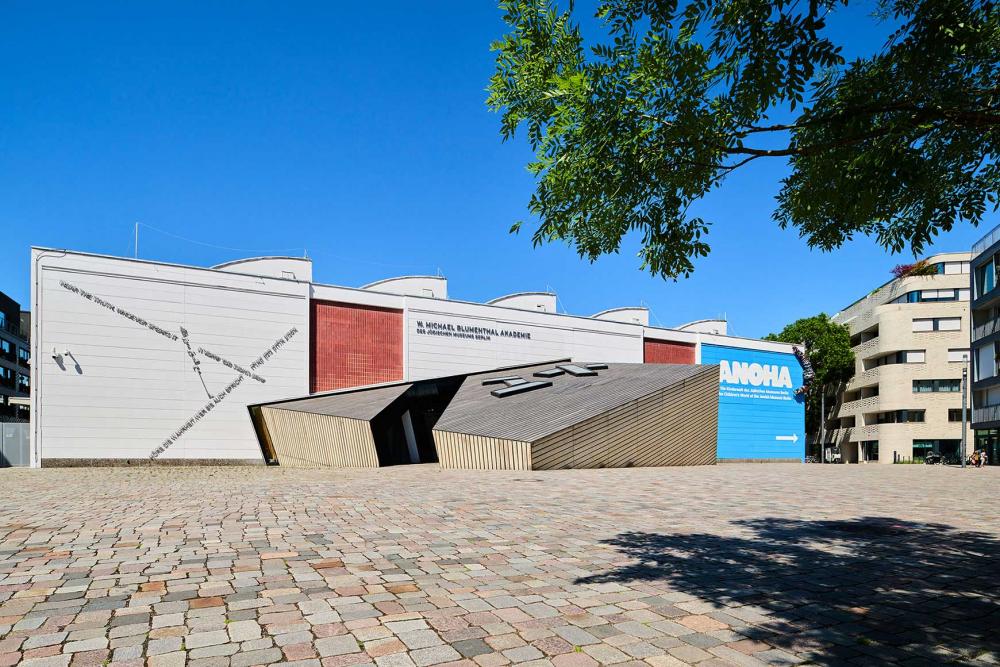 View of the wooden main entrance to the academy building.