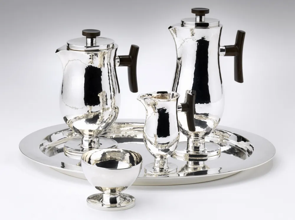 Silver platter with two large kettles, one small milk jug, and a sugar bowl