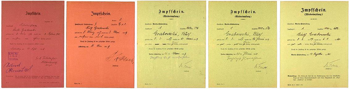 Five vaccine certificates, two of them red and three green