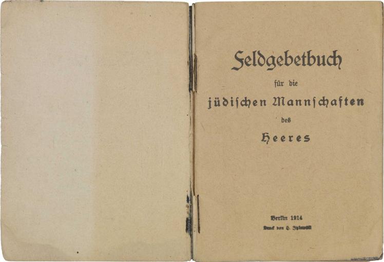 Aufgeschlagene Doppelseite mit Titelseite, gedruckt