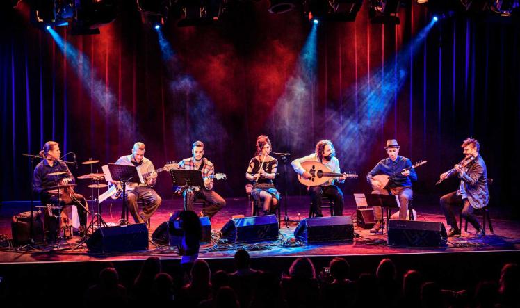 A band sits on a stage.