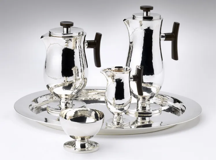 Silver platter with two large kettles, one small milk jug, and a sugar bowl
